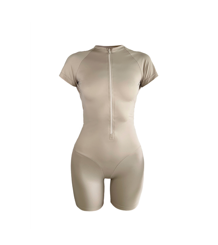 Women's sporty zippered romper in cream. Buy now with delivery in Bali 
